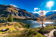 A View Of The Cavlocc Lake, In Engadine, Switzerland, And The Mountains Surrounding It And With Autumn Colours.
