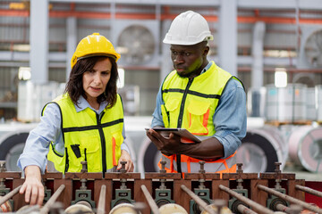 female engineer supervisor advice technician foreman to inspect spare part equipment of production machine conveyor belt, team of diverse workers working together at industrial manufacturing factory