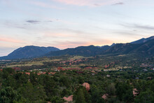 A Colorful Sunset Over Pike's Peak And Other Blue Mountains And Red Rocks On A Fall/summer Evening, As Viewed From Garden Of The Gods In Colorado Springs, CO