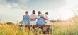 © Soloviova Liudmyla - ..Four smiling women dressed light summer clothes harm embracing sitting on the meadow bench during outdoor walking. Woman's friendship, relations, and happiness concept image.