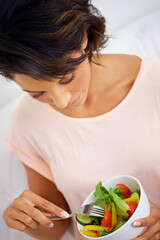 Wall Mural - Food, health and young woman with a salad at home with vegetables for wellness, organic or diet. Top view, nutrition and female person from Mexico eating healthy meal with produce in living room.