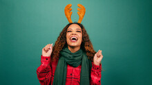 Excited Young Woman Jumps And Dances Excited For Christmas, Studio