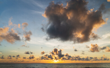 Wall Mural - abstract amazing scene of stuning colorful sunset or sunrise with clouds background in nature and tr