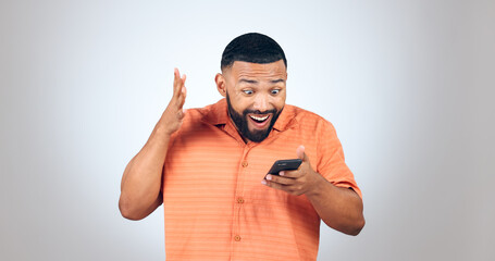 Poster - Man, smartphone and surprise, giveaway winner and celebrate with reaction on white background. Social media, communication and wow, reward or bonus online with email notification and shock in studio