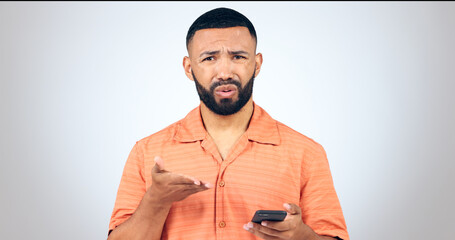 Aufkleber - Portrait of man in studio with phone, frustrated and confused with connection problem, 404 or glitch. Communication, anger and person with smartphone with scam, phishing or fraud on white background.