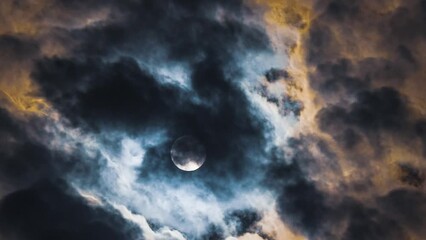 Wall Mural - full moon in terribly beautiful clouds. time lapse. black and yellow colours of clouds that move aga