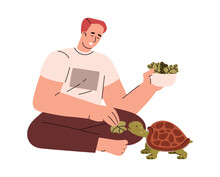 Young Man Feeding Turtle With Salad Leaves.