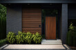 © barmaleeva - Contemporary exterior of home with dark ceramic tiles as siding of house and tall front door. Generative AI