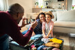 © Marko Geber - Loving father captures a moment with mother and daughter packing for a vacation