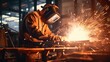 © ETAJOE - Metal welder working with arc welding at wokshop, Industrial worker is welding steel products in a factory, sparks fly