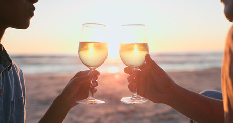 Canvas Print - Sunset, beach and couple with wine, toast and anniversary with happiness, marriage and vacation. Romance, man and woman with alcohol, cheers or relationship with seaside holiday, lens flare or luxury