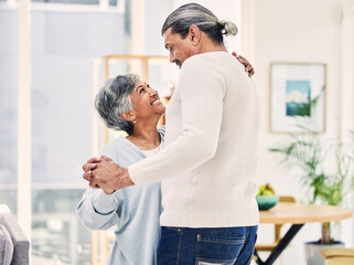 Wall Mural - Senior couple, hug and holding hands in dance for love, care or bonding together in living room at home. Elderly man and woman enjoying quality time, weekend or holiday celebration for anniversary