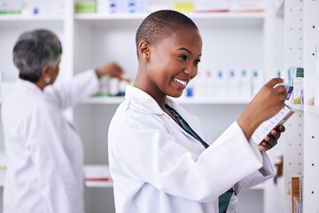 Poster - Happy black woman, pharmacist and pills for inventory inspection or checking stock on shelf at pharmacy. African female person in medical healthcare with pharmaceutical product for medication storage