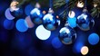 Deep blue color Christmas tree ornaments with bokeh background. Fir tree branches in trendy beautifully decorated with blue balls with lights garland. Merry Xmas and New Year concept.