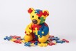 Colorful bear toy with autism symbols on a white banner, representing autism awareness day. Illustration. Generative AI