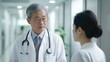 © Jose - Asian senior doctor talking to a nurse