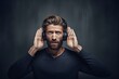 man with hearing problems making an effort to listen