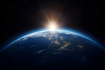 sun rising behind planet earth seen from space.