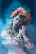 © Creative Factory - Beautiful white old woman statue with flowers on her head,smoke dark backgorund.