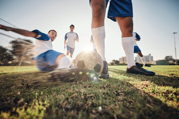 Wall Mural - Closeup, ball and soccer with men, tackle and exercise with sports, competition and training. Zoom, football and healthy athletes with energy, fitness and teamwork for a match, action and blur motion