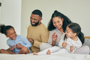 Canvas Print - Family, playful and bed with children in morning for quality time on weekend in home with care. Happiness, parents and kids together for fun in bedroom with laugh or bonding for love with smile.