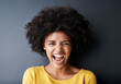 Laughing, black woman and funny portrait in studio with happiness, freedom or wellness in mockup space. Happy, face and African person with smile, emoji and crazy reaction on grey background