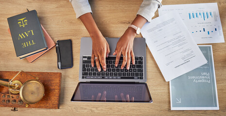 Lawyer, hands and laptop typing with divorce case and notes with website in a office. Desk, top view and law firm with planning paperwork for settlement report with contract document with computer
