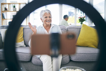 Sticker - Mature woman, live streaming and vlog in home for social media, chat broadcast or wave to audience online. Happy lady, content creator and filming digital podcast in living room, phone and ring light