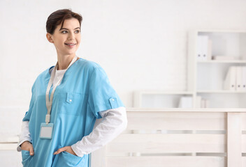 Canvas Print - Portrait of female medical intern in clinic