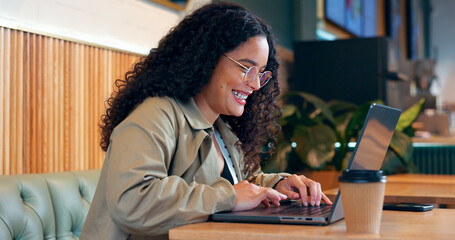 Poster - Happy woman in coffee shop, typing on computer and remote work, reading email or writing blog, article or search on internet. Laptop, freelancer and copywriting in cafe, smile at restaurant or table
