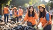 Volunteers cleaning up garbage on a street in orange vests and hard hats