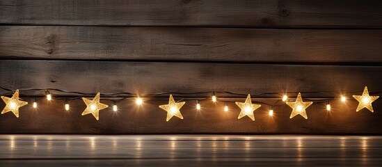 Wall Mural - Close up colorful star lights on an old wooden board set against a Christmas themed backdrop