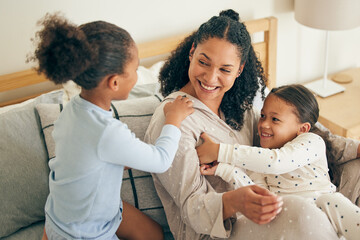 Wall Mural - Mother, home and children playing or happy with parent together in the morning laughing in a bedroom on a bed. Funny, bonding and mom enjoy quality time with kids or girls with happiness and love