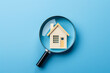 House search, home buying and selling, loan, mortgage and real estate investment. Choice of real estate to buy and invest in. Magnifying glass and house icon on blue background. Hunt for new property