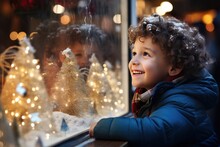 Excited Child Looking Into The Window Of A Christmas Shop With Bokeh Lights