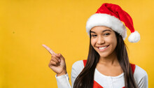 Woman In Santa Hat Showing Thumbs Up