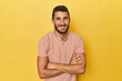© Asier - Young Hispanic man on yellow background laughing and having fun.