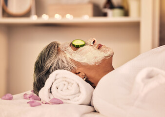 Wall Mural - Woman, spa and relax with face mask, cucumber and skincare treatment at beauty salon. Calm mature female client cooling eyes at wellness resort with facial cleaning, hydration glow or cream cosmetics