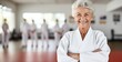 © Denis - Portrait of happy senior woman at karate course