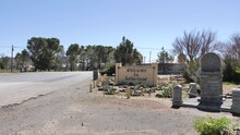 Wide Angle: Entrance To Sutherland Town With Welcome Sign And Marble Memorial To The Great Trek