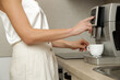 © triocean - Beautiful woman having her first morning coffee in the kitchen