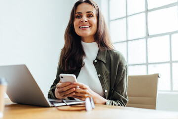 Professional business woman working with a mobile phone