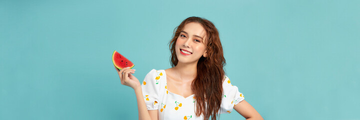 Wall Mural - Pretty young woman with juicy watermelon on color background