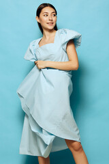 Wall Mural - woman style dance dress beautiful model fashion blue young summer studio