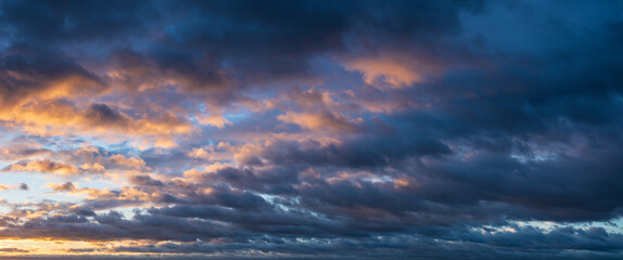 Wall Mural - Stormy Sky with dramatic clouds at sunrise