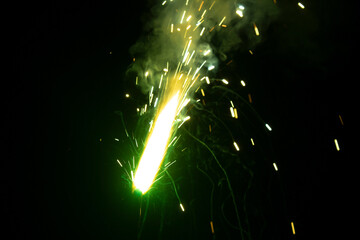 Wall Mural - sparks from the firework on a black background close-up