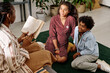 © AnnaStills - Excited brother and sister listening to mother reading about life of Martin Luther King, Jr