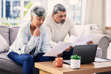 Canvas Print - Documents, thinking and senior couple on laptop for finance paperwork, taxes and retirement at home. Planning, decision and elderly people on sofa reading insurance, bills and asset management choice