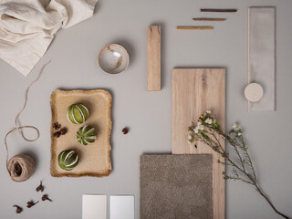 Wall Mural - Creative flat lay composition with textile and paint samples, panels and cement tiles. Stylish interior designer moodboard. Light beige and gray color palette. Copy space. Template.