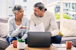 © D Theron/peopleimages.com - Senior couple, documents and stress on laptop with financial paperwork, taxes or retirement questions at home. Planning, debt and elderly people on sofa for life insurance, bills or asset management